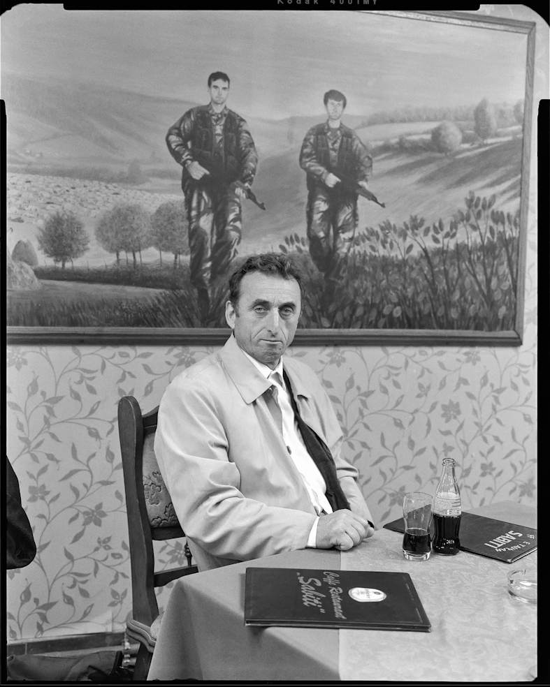 Azem from the Portraits Series by Daniel Cosentino, a photographic portrait rendered with muted tones and textured depth, reflecting presence, identity, and latent memory.